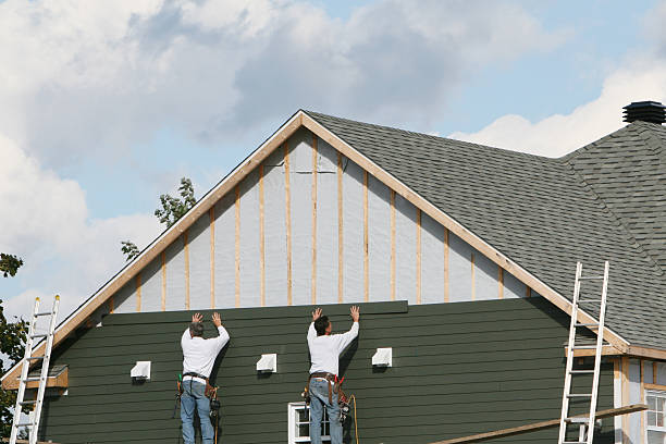 Professional Siding technician working in East Fultonham, OH